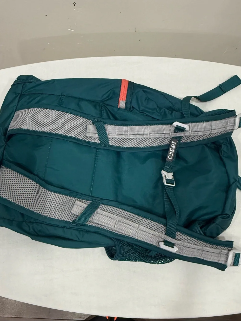 CamelBak backpack in teal with coral logo
